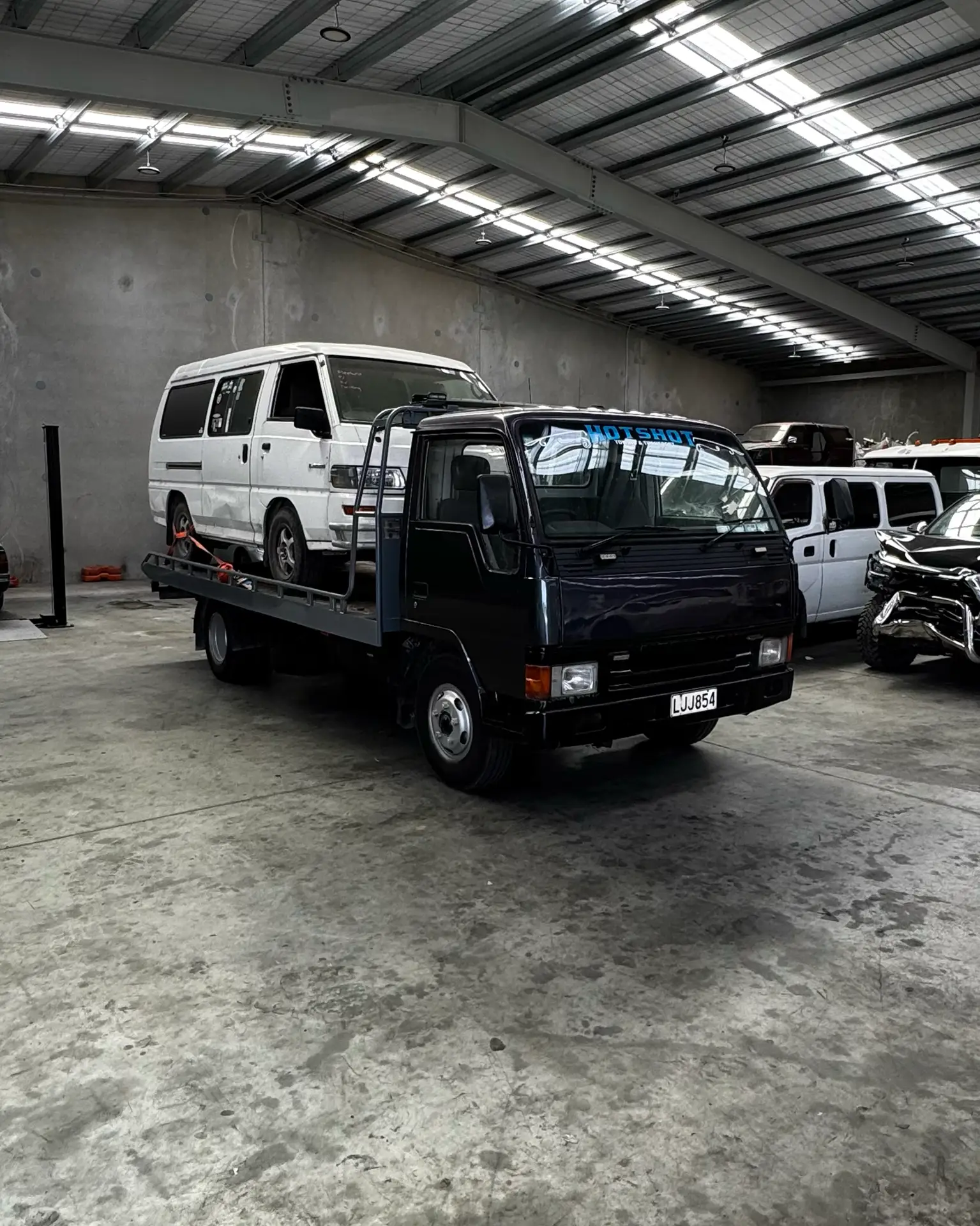 img3 Hotshot Towing & Transport towing a Toyota Hiace