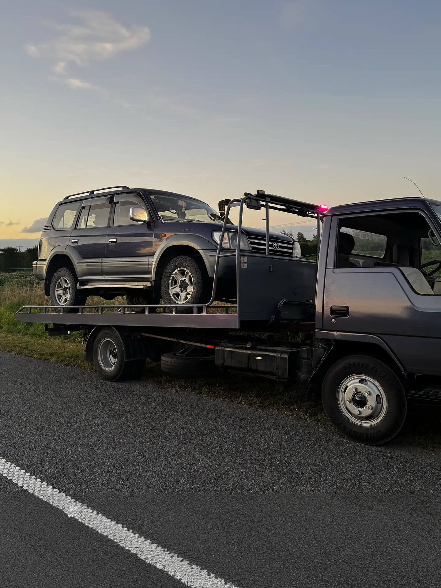 winch Hotshot Towing & Transport towing a Toyota Prado